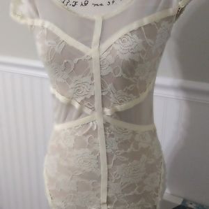 Nude mini dress with bondage cross patterns